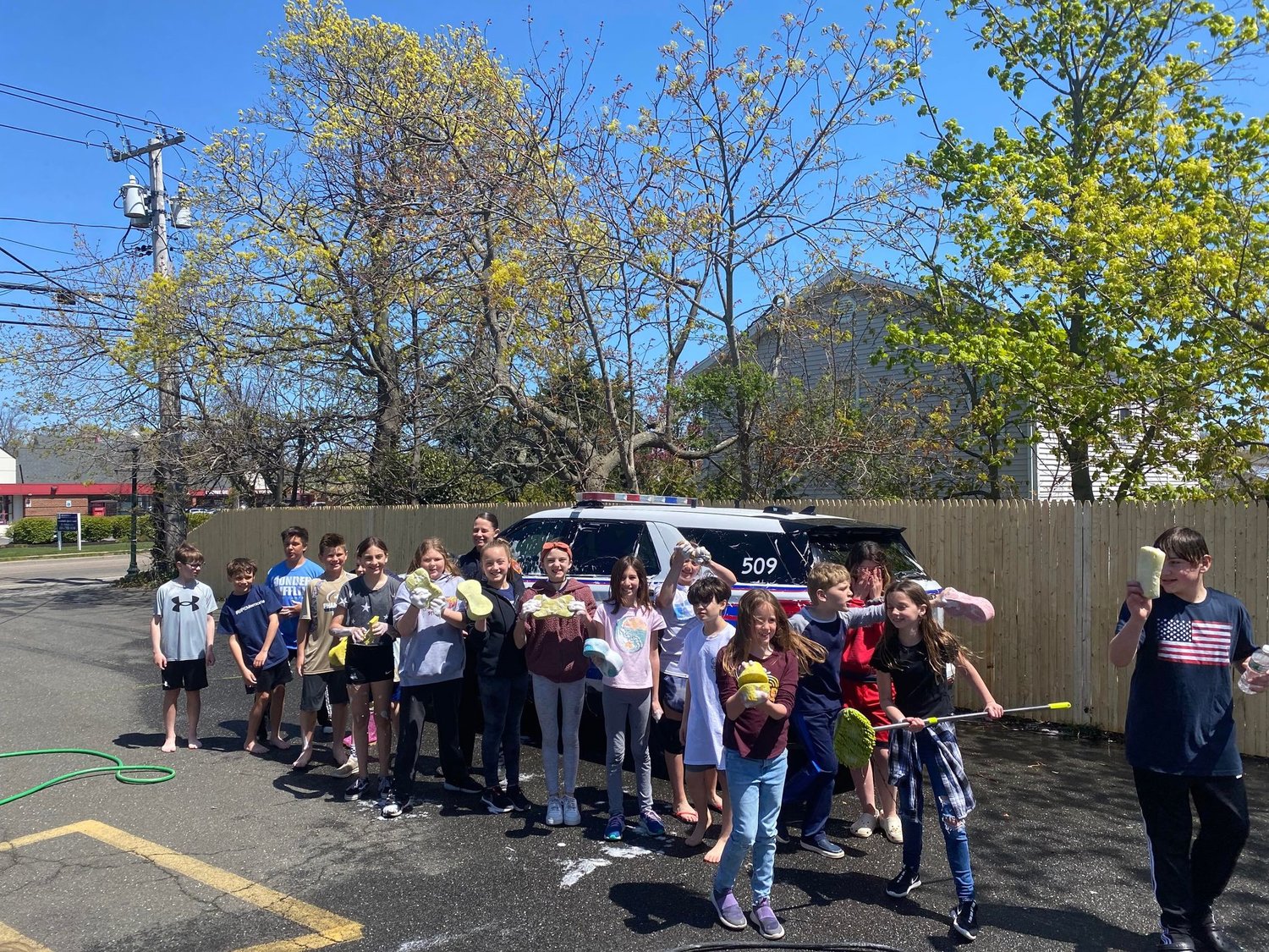 Blue Point fifth graders host a car wash this spring, and even receive a visit from a local police officer to get his squad car cleaned to serve the neighborhood.
“Geoghan Insurance has continued to be a supportive staple in this community by graciously allowing community organizations to use their property to raise tens of thousands of fundraised dollars!,” said Eric Ferraro